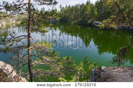 Picturesque Landscape With Lake And Coniferous Forest In Korostyshiv Quarry, Zhytomyr District, Nort