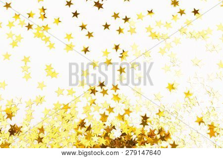 Golden Star Shaped Confetti On White Background. Holiday, Festive And New Year Concept.flat-lay, Top