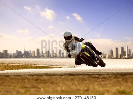 Man Wearing Safety Suit Riding Sport Racing Motorcycle On Sharp Curve Highway