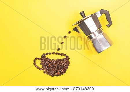 Coffee Beans Pouring From Coffee Maker Into Cup Made From Beans. Bright Yellow Background. Love Coff
