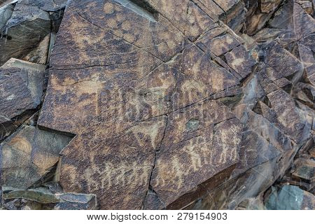 The Ancients Petroglyphs In Tamgaly Tash In Kazakhstan
