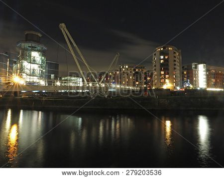 A Cityscape View Of The Canal Entrance To The Clarence Dock Area Of Leeds With A Pedestrian Bridge C