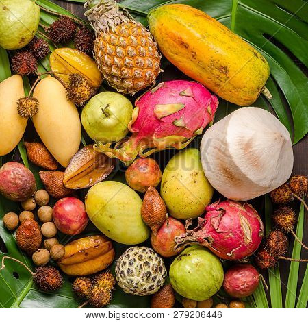 Summer Detox With Vegan Food. Assorted Thai Tropical Fruits On A Dark Wooden Rustic Background.