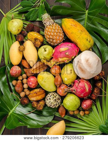 Summer Detox With Vegan Food. Assorted Thai Tropical Fruits On A Dark Wooden Rustic Background.