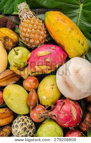 Summer Detox With Vegan Food. Assorted Thai Tropical Fruits On A Dark Wooden Rustic Background.
