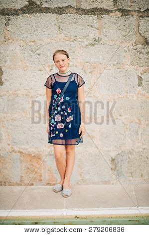 Outdoor Fashion Portrait Of Beautiful Young Girk Wearing Blue Fashionable Dress