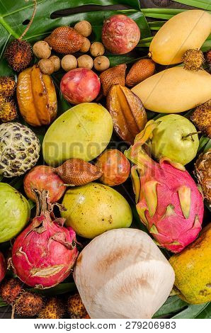 Summer Detox With Vegan Food. Assorted Thai Tropical Fruits On A Dark Wooden Rustic Background.