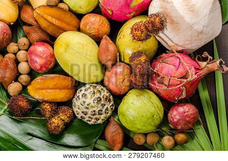 Summer Detox With Vegan Food. Assorted Thai Tropical Fruits On A Dark Wooden Rustic Background.