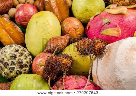 Summer Detox With Vegan Food. Assorted Thai Tropical Fruits On A Dark Wooden Rustic Background.