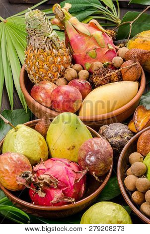Summer Detox With Vegan Food. Assorted Thai Tropical Fruits On A Dark Wooden Rustic Background.