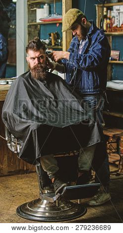 Hipster Lifestyle Concept. Hipster Client Getting Haircut. Barber With Clipper Trimming Hair On Temp