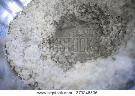 Crushed Ice Mixed With Salt In Stainless Bowl Prepared For Making Homemade Ice Cream. Traditional Co