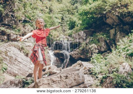 Little Girl Enjoying View Of Waterfall In Krasnay Poliana