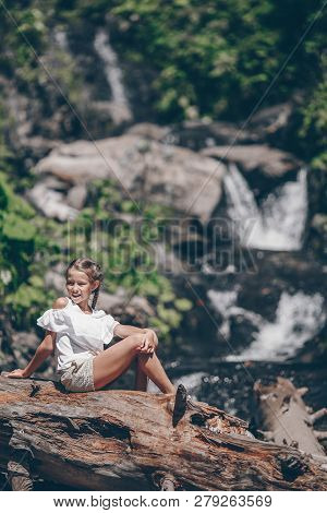 Little Girl Enjoying View Of Waterfall In Krasnay Poliana