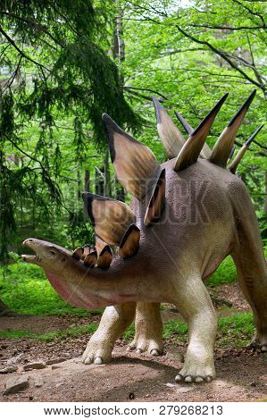 Szklarska Poreba, Poland - May 10, 2018: Stegosaurus Model Standing In A Forest On The Dino Park