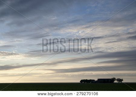 Farmbuildings Just Before Sunset Near The Dutch Village Usquert In The Province Groningen