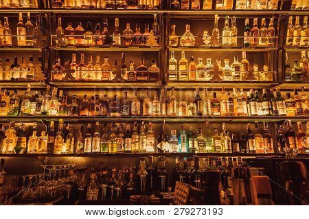 Kyiv, Ukraine - 15 Jan: Huge Wall Of Bar With Whisky Bottles, Rum, Gin, Vodka For Dtrong Drink Lover