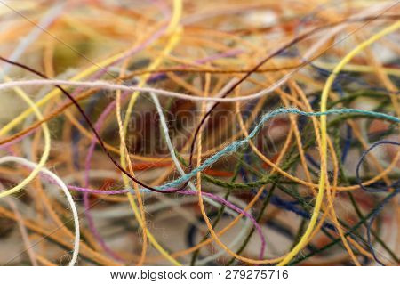 Multi-colored Tangled Colorful Needlecraft Silk Thread Rope. Macro Shot. Abstract Colors Background