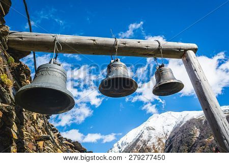 Bells In Lamaria Church In Zhibiani - Ushguli Community Of Villages, Upper Svaneti, Georgia. Snow Co