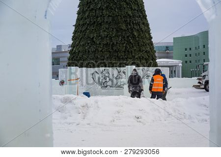 Three Workers Talking On The Construction Site