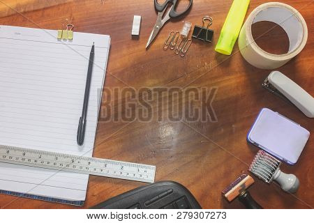 Office Suply With Stamp Scissors Clip Ruler Accessories Equipment And Tape On The Top View And Woode