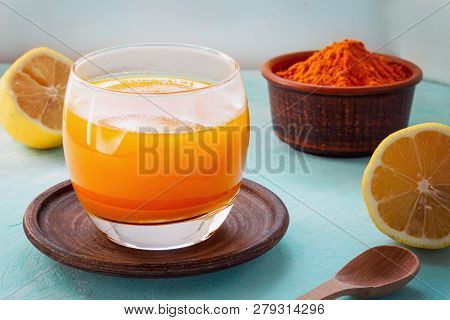 A Warm Drink From Turmeric, Lemon And Honey For Better Health. Immunostimulating Natural Cocktail. C
