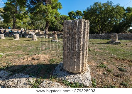 Olympia, Greece - October 31, 2017: The Remains Of An Architectural Column In Archaeological Site Of