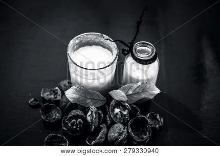 Close Up Of Akhrot Ka Dudh Or Walnut Milk On Wooden Surface With Raw Milk In  A Glass Bottle And Som