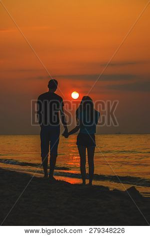 Lovers On The Sea Looking At The Sunset. Selective Focus