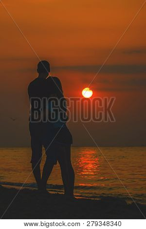 Lovers On The Sea Looking At The Sunset. Selective Focus