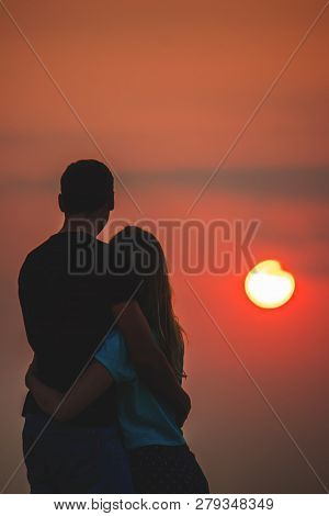 Lovers On The Sea Looking At The Sunset. Selective Focus