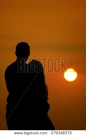 Lovers On The Sea Looking At The Sunset. Selective Focus