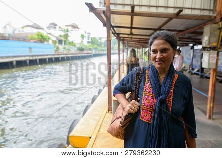Indian Woman At Canal Boat Station In Bangkok Thailand