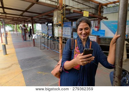 Indian Woman Using Phone At Canal Boat Station In Bangkok Thailand