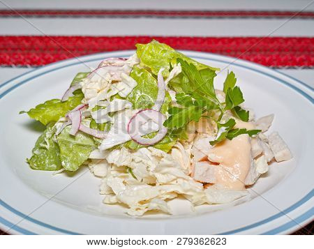 Salad Of Greens, Onions And Cheese, Dressed With Sauce.