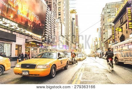 New York - March 27, 2015: Yellow Taxi Cab And Everyday Life Near Times Square In Manhattan Downtown