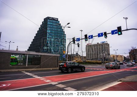 Poznan, Poland - November 21, 2018: Cars Driving And Passing Green Traffic Lights On A Intersection 