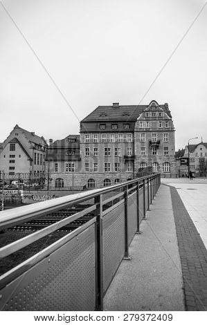 Poznan, Poland - November 21, 2018: Metal Barrier Next To A Sidewalk Leading The The Adam Mickiewicz