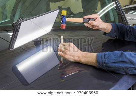 Professional Mechanic Removes Dents On The Car Body