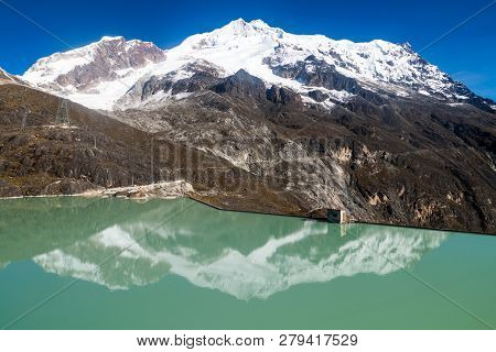 Zongo Dam, Located In Zongo Pass In The Altitude Of 4700m, Bolivia. Peak Of Huayna Potosi Mountain I