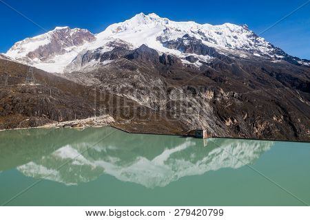 Zongo Dam, Located In Zongo Pass In The Altitude Of 4700m, Bolivia. Peak Of Huayna Potosi Mountain I