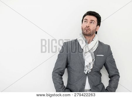 close up.business man in scarf looking up somewhere