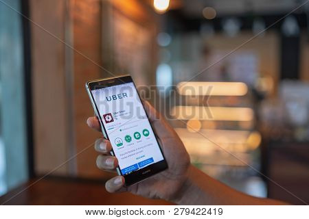 Chiang Mai, Thailand - June 09,2018: Man Holding Huawei With Uber Apps. Uber Is Smartphone App Trans