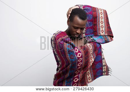 Authentic Studio Shot Of Graceful Elegant African American Man Moving Gently, Wearing Ethnic Poncho,
