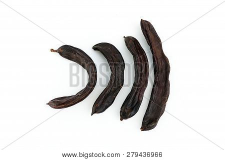 Carob On White Ground, Dry Carob
Locust Bean On A White Background,
Carob On A Plate, On A White Bac