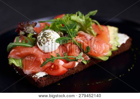 Healthy Snack, Salmon Toast For Breakfast Or Lunch With Rye Bread, Sliced Avocado And Mozzarella. Tr