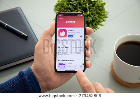 Alushta, Russia - November 4, 2018: Man Hand Holding Iphone X With Social Networking Service Tinder 