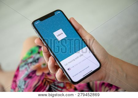 Alushta, Russia - September 27, 2018: Woman Hand Holding Iphone X With Application Taxi Uber On The 