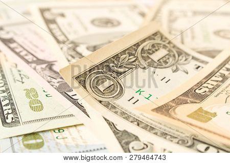 Abstract Background Of Various Dollar Bills. Selective Focus