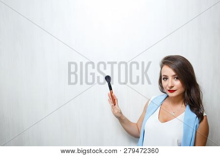Professional Make Up Artist With Cosmetic Brush. Mockup. Copy Space For Text